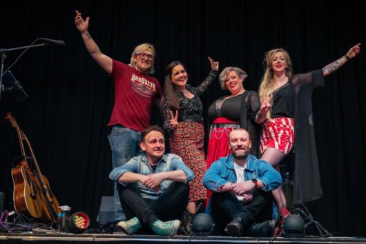 Photo of the six members of Dashh--